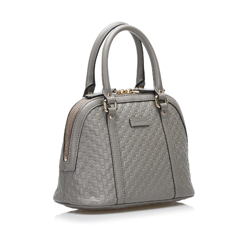 Women Gucci Sylvie bags with a monogram - embossed leatherGucci Mini Microguccissima Dome Satchel (SHG-Iq6jBw)