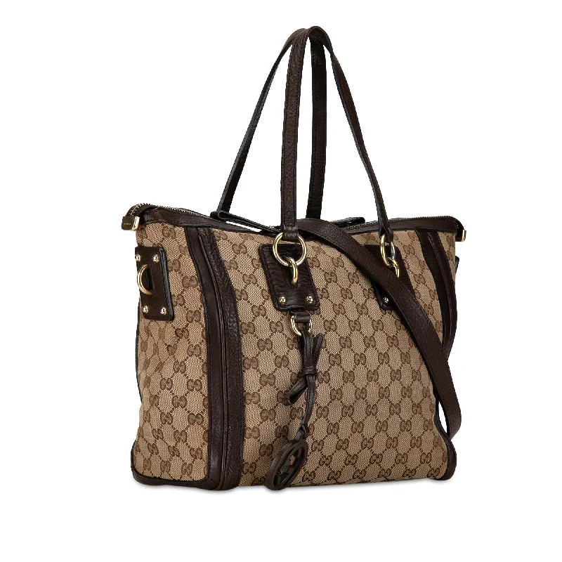 Gucci tote bags for women with a spacious interiorGucci GG Canvas Charm Satchel M7VWtv)