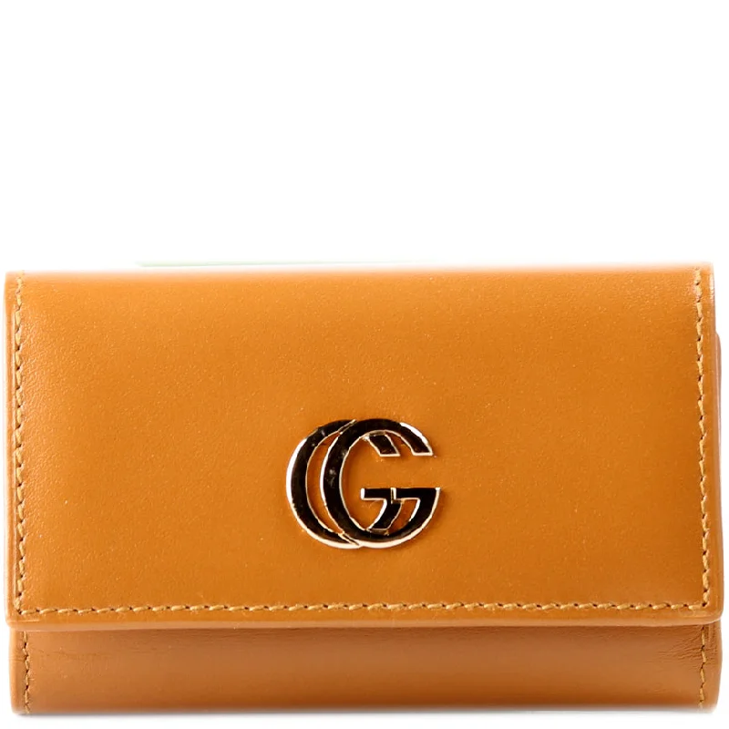 Women Gucci Sylvie bags with a monogram - embossed leatherGucci Key Case Smooth Leather 033.0416