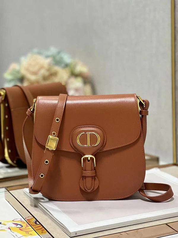 Christian Dior handbags with a snap - button closure and a decorative buckleDior Bag